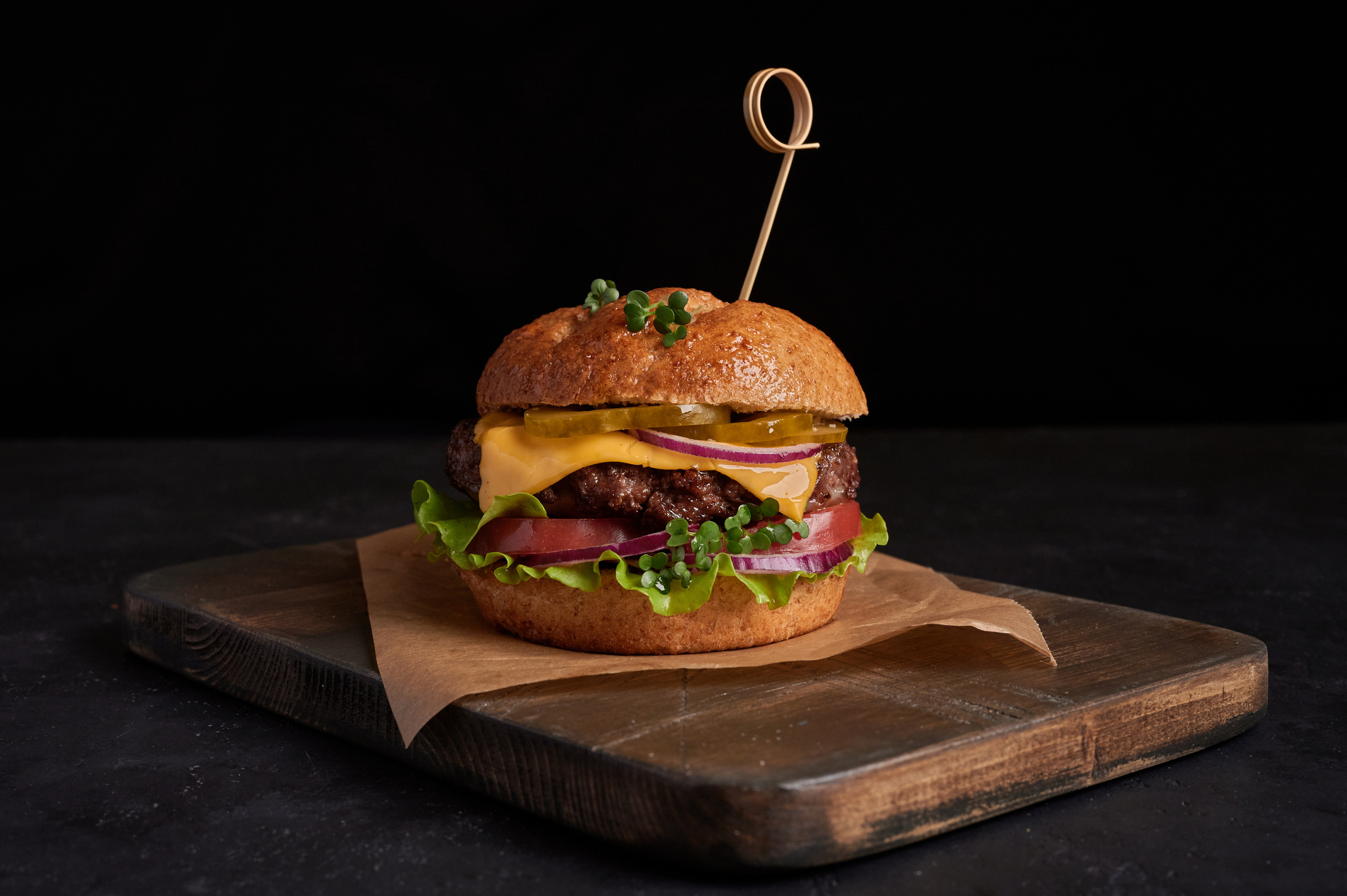 Gourmet Burger on a Wooden Board